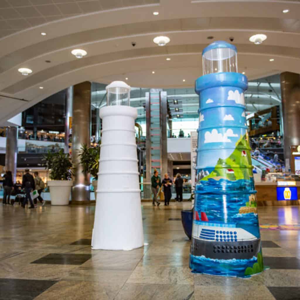 Two decorated lighthouses in Southampton shopping centre.