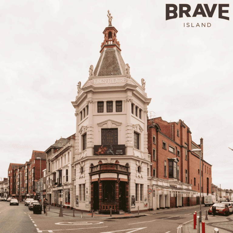 Street-view of King's theatre. A large, cream coloured building built in the early 20th Century.