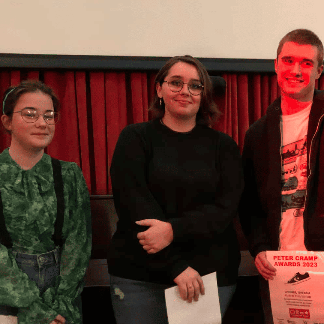 Three young filmmakers at the Picture the Music competition awards and screening