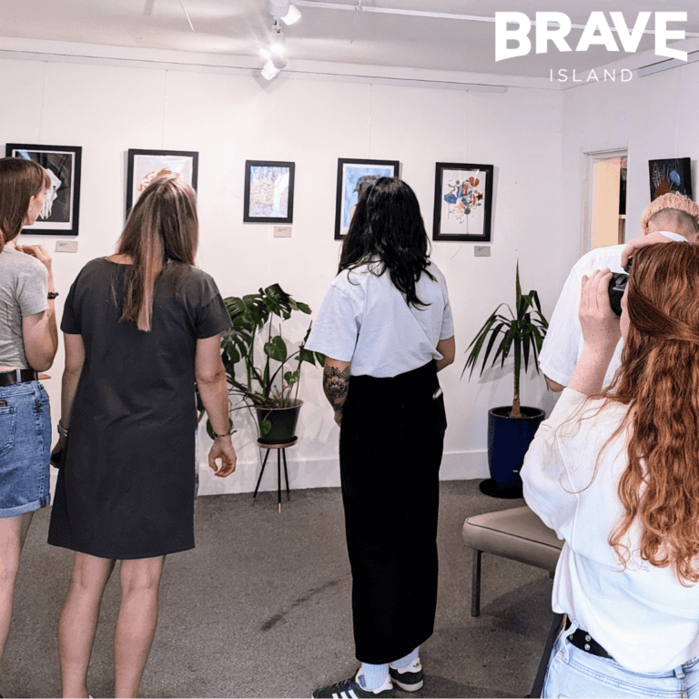 People viewing the artwork as part of the Young Artist Award 2023 exhibition