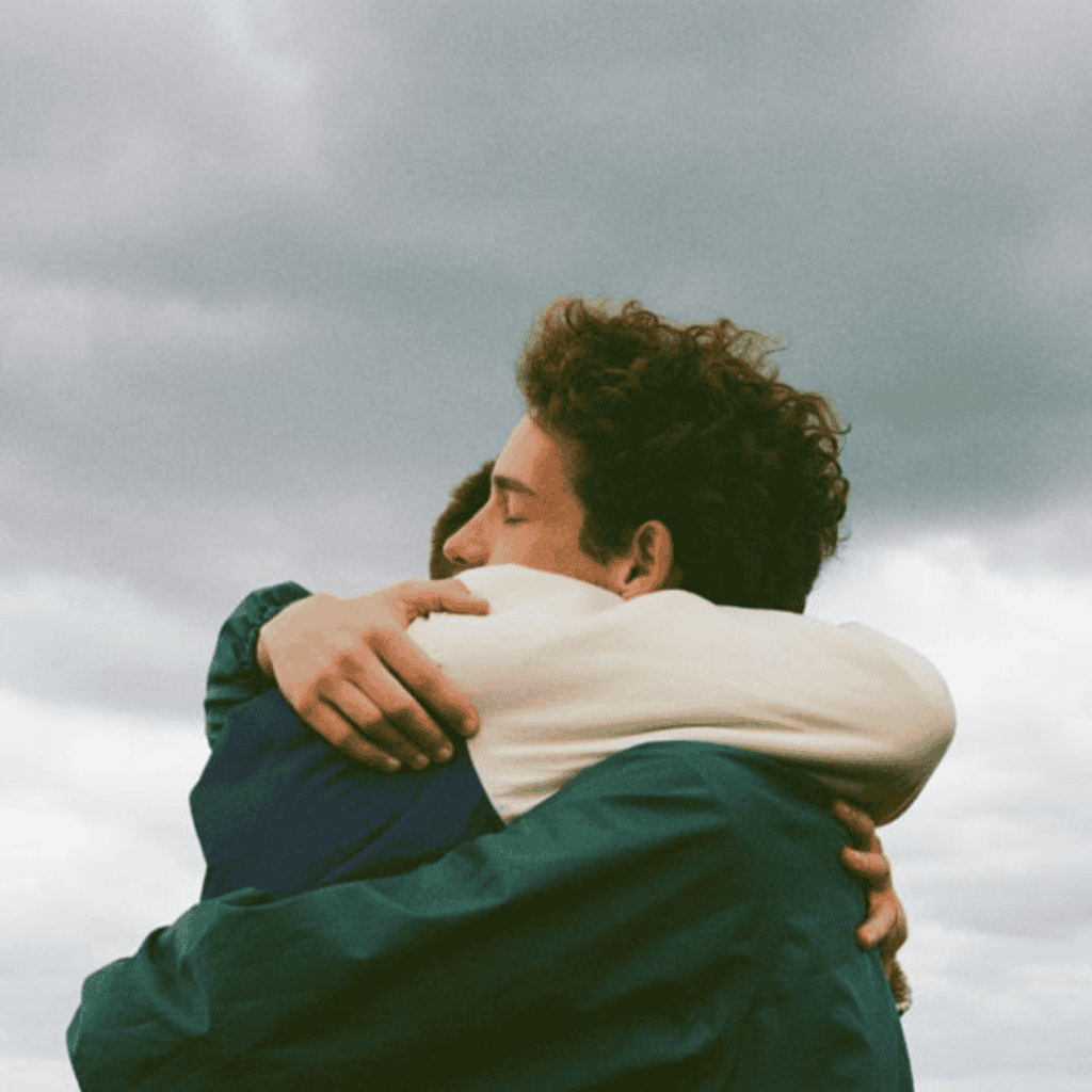 Two people hugging in the sky