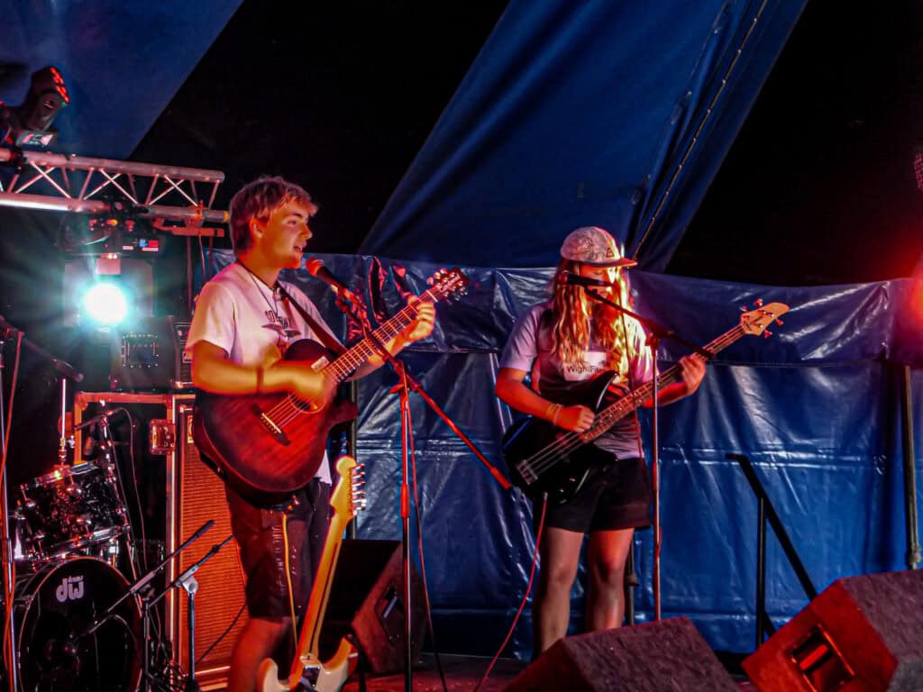 A photograph of two young people performing on a stage at Ventnor Fringe. 